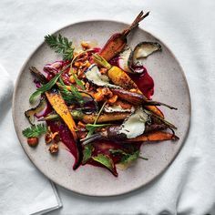 Roasted Carrots with Beet Puree, Goat Cheese, and Hazelnuts | Earthy carrots and beets meet toasty hazelnuts and tangy goat cheese in this substantial vegetable course. Get the recipe at Food & Wine. Beet Puree Recipes, Haute Cuisine Recipes, Beet Puree, Carrots Roasted, Hazelnut Recipes, Creamy Carrot Soup, Plat Vegan, Potato Gnocchi, Red Beets