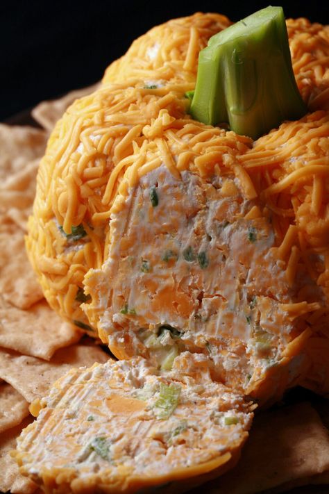 A pumpkin shaped cheese ball with green onion visible inside. Light Thanksgiving Appetizers, Pumpkin Shaped Cheese Ball, Pumpkin Cheese Ball Recipe, Shaped Cheese Ball, Halloween Cheese Ball, Pumpkin Cheese Ball, Cheese Ball Dip, Turkey Cheese Ball, Pumpkin Appetizers