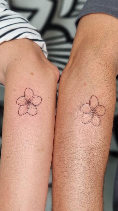 #tattoo #frangipani #flower #bali Fine Line Flower Tattoo Matching, Sampaguita Fine Line Tattoo, Minimalist Plumeria Tattoo, Plumeria Tattoo Simple, Plumeria Shoulder Tattoo, Plumeria Fine Line Tattoo, Indonesian Flower Tattoo, Hibiscus Tattoo On Arm, Small Tropical Flower Tattoo