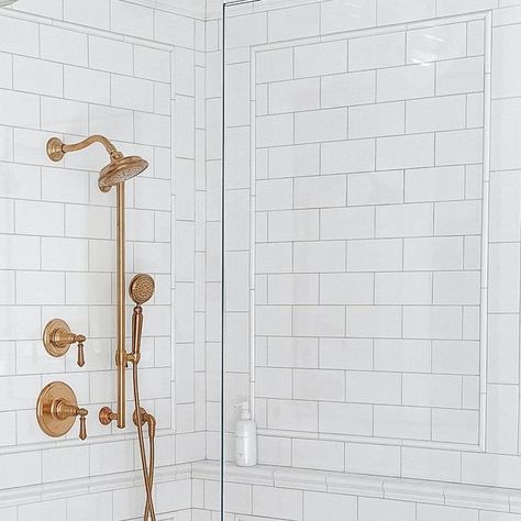 Erin Broege | theheartandhaven.com on Instagram: "Our shower! Subway tile is classic but I wanted to make it feel special. So, I added trim pieces in a picture moulding design to create interest and these stunning shower fixtures by @kohler to make it pop (the finish is called Vibrant Brushed Moderne Brass). The combo of the showerhead, handshower and slidebar in this color instantly elevated the design. Truly the epitome of form and function because it is so pretty to look at but I also LOVE Kohler Shower System, Shower Subway Tile, Picture Moulding, Moulding Design, Kohler Shower, Kohler Artifacts, Picture Molding, Shower Fixtures, Brass Shower