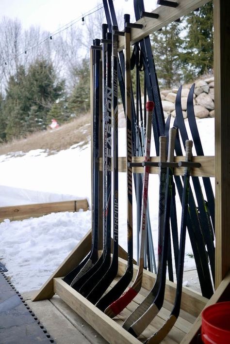 This is the second winter that we have built a backyard ice rink and I decided this year that we needed to get a handle on hockey stick storage rather than just leaning them against the house or piling them up on the ground. We also needed a place to store our cross country skis. I decided to build a freestanding hockey stick rack that would also hold the skis and poles on the other side. This way I could move everything into storage just like it is in the spring. I enjoy projects like… Hockey Stick Storage, Backyard Ice Rink, Backyard Rink, Outdoor Rink, Hockey Sticks, Ice Rink, Bedroom Decorating Ideas, Hockey Stick, Bedroom Decorating