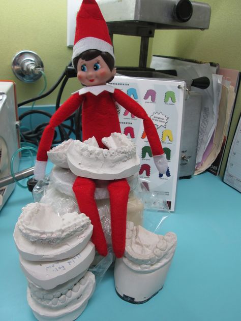 Hard at work trimming models. Dental Elf On The Shelf, Dental Elf On The Shelf Ideas, Elf On The Shelf Dental Office, Dental Decor, Orthodontics Marketing, Ortho Office, Christmas Dental, Shelf Inspiration, Dental Fun