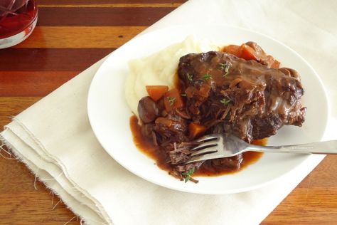 Synonymous with winter cooking, slow-cooked beef cheeks are hearty, satisfying and a real crowd pleaser on a chilly evening. This recipe cooks the beef in the slow cooker with red wine and classic flavours and serves it with a simple garlic mash. Beef Cheeks Recipe Slow Cooker, Beef Cheeks Recipe, Slow Cooked Beef Cheeks, Red Wine Recipe, Classic Pot Roast, Recipe Slow Cooker, Winter Cooking, Beef Cheeks, Potted Beef