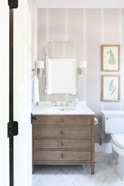 Restoration Hardware Maison Single Vanity in a transitional bathroom designed white marble countertop, glass and nickel sconces, and a French mirror. Bathroom Wall Sconces Single Vanity, Restoration Hardware Maison, Restoration Hardware Bathroom, Herringbone Wall Tile, Restoration Hardware Vanity, Modern Bathroom Art, Marble Herringbone Tile, Transitional Bathroom Design, Herringbone Tile Floors