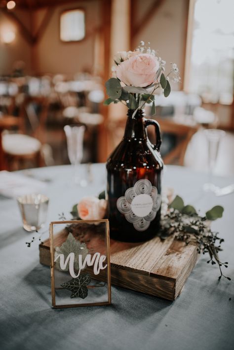 Beer Growlers as centerpieces, SURE we can make that work! Growlers Wedding Decor, Wedding Growler Centerpiece, Whiskey Bottle Wedding Centerpieces, Brewery Wedding Centerpieces, Distillery Wedding Decor, Beer Growler Centerpiece, Growler Centerpiece Wedding, Growler Decor, Beer Mug Centerpiece