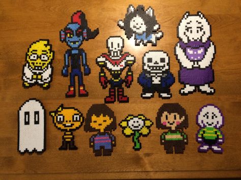 undertale characters perler beads, alphys sans papyrus temmie toriel frisk chara flowey asriel napstablock undyne monster boy Undertale Perler Beads, Perler Bead Ideas, Undertale Characters, Sans Papyrus, Hamma Beads Ideas, Monster Boy, Perler Ideas, Pearl Beads Pattern, Easy Perler Beads Ideas