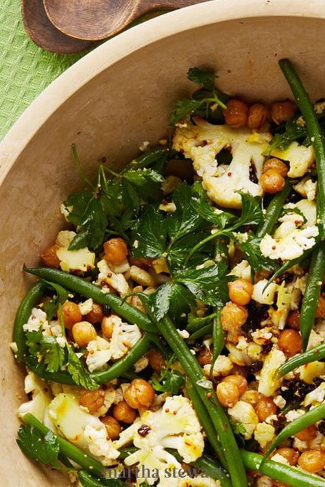 We love the combination of raw cauliflower, cooked crisp-tender green beans, and crunchy roasted chickpeas in this salad. Fresh parsley and dried currants complete the dish. #marthastewart #recipes #recipeideas #comfortfood #comfortfoodrecipes Pasta With Green Beans, Raw Cauliflower, Lemon Green Beans, Bean Pasta, Basil Recipes, Green Bean Salads, Cold Pasta Salad, Cauliflower Salad, Tasty Healthy