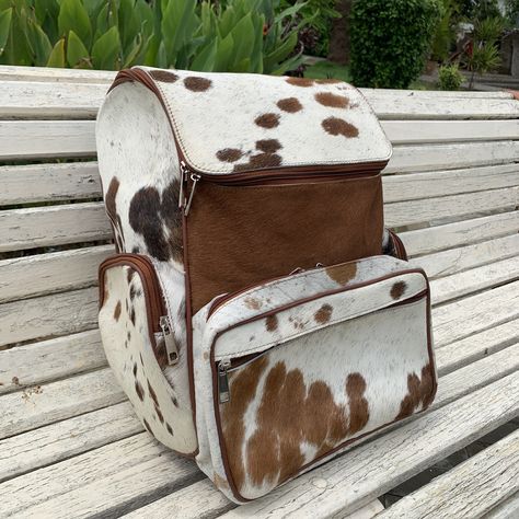 cowhide leather backpack, Cowhide Backpack Bag For School, cowhide bag, cowhide shoulder bag, school bag, western backpack We will send you photo of your finished Cowhide Bag before dispatching to your destination. This luxurious, 100% everyday use bag, cowhide shoulder bag can be used for carrying items in style. It features a Natural Fur finish and Durable Stitching. It is perfect for carrying Books, and daily essentials in style. Built for those who want to look as great as they feel, our sho Rectangular Cow Print Travel Bag, Cow Print Leather Bag For Daily Use, Large Capacity White Leather Backpack, White Leather Large Capacity Backpack, White Large Capacity Leather Backpack, Leather Cow Print Bag For Everyday Use, Brown Cow Print Bag For Everyday Use, Brown Cow Print Bag, Rectangular Calf Hair Travel Bag