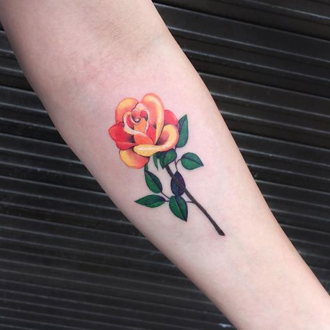 Orange rose tattoo by Zihee.   Rose tattoos are one of the most sought after tattoos in the world and has always been a classic symbol of beauty, balance and love. Enjoy! Orange Rose Tattoo, Rose Bud Tattoo, Yellow Rose Tattoo, Yellow Rose Tattoos, Tato Tradisional, Rose Tattoo Meaning, Tattoo Roses, Pink Rose Tattoos, Tato Dengan Makna