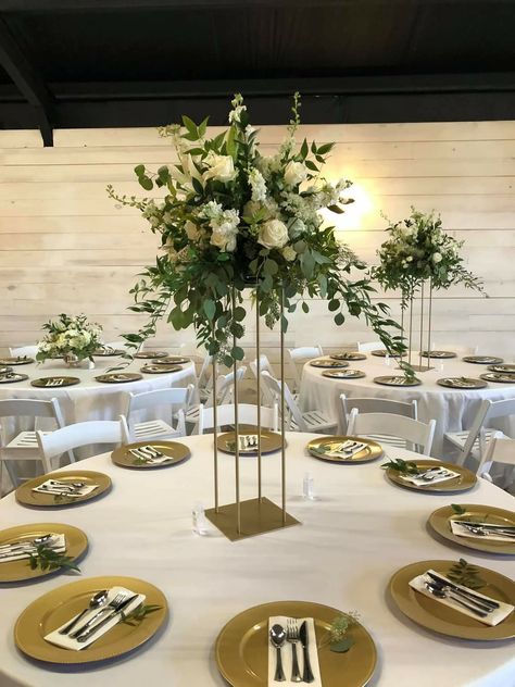 A mixed white centerpiece with mixed greenery atop a gold square stand White Centerpiece, Table Decorations, Square, Gold, Furniture, White, Home Decor, Home Décor