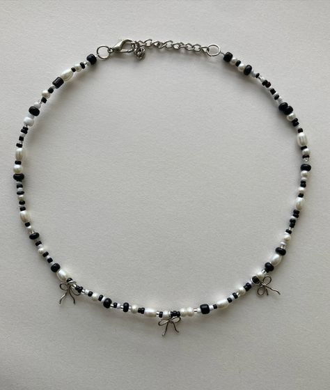 B & W 🖤🤍 . . . . . . . . Handmade jewelry, wire jewelry, beaded bracelets , small business, black and white necklaces, dainty, silver bows Black And White Beaded Bracelet, Black And White Necklaces, Silver Bow, White Necklace, Wire Jewelry, Handmade Jewelry, Beaded Bracelets, Black And White, Silver