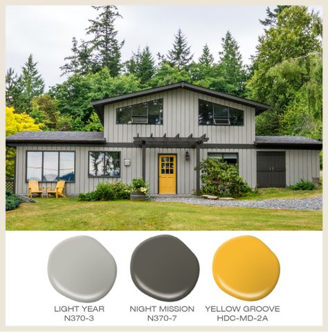 Color of the Month: Sunny Yellow! A yellow door highlights the access to this tone on tone gray house. Featured Behr Paint Colors: Light Year N370-3, Night Mission N370-7, and Yellow Groove HDC-MD-2A Yellow Front Doors, Best Exterior Paint, House Paint Color Combination, Yellow Door, Gray House, House Green, Exterior House Paint Color Combinations, Exterior House Paint, Yellow Doors