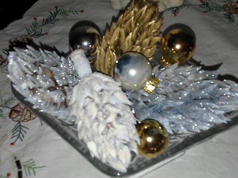 Magnolia Seed Pods sprayed with silver glitter, white and gold for Christmas centerpiece. Magnolia Seed Pods Crafts Christmas Decorations, Magnolia Seed Pod Crafts, Magnolia Tree Seed Pods Crafts, Magnolia Cones Crafts, Magnolia Pods Crafts, Seed Pods Crafts, Magnolia Ornaments, Magnolia Crafts, Magnolia Seed Pods