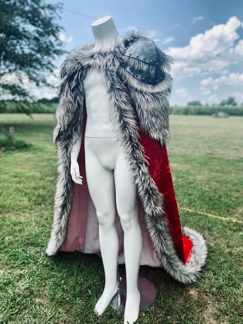 MADE TO ORDER: please allow 4-8weeks to create for you. (If needed sooner, please inquire and I can do my best to accommodate) Includes: 1. Cloak A beautiful high end, high quality Kings cloak made with Eva foam armor shoulders, a crushed velvet fabric, and trimmed in very lush thick faux coyote fur (color will vary). The armored shoulders are primed and painted with a dry brush technique to give the appearance of distressed metal without the weight. Custom cloak will be as close as possible to Wolf Head Cloak, Fantasy Fur Cloak, Fur Cloak Fantasy Art, Barbarian Outfit Male, Kings Cloak, Armor With Fur, Fur Armor, Royal Cloak, Fur Cloak