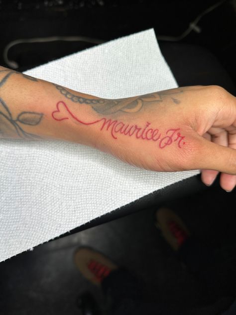 Red Tattoo Black Outline, Tattoo Name On Neck, Name Tattoos In Red Ink, Name Incorporated Tattoos, Jada Tattoo Name, Name Tattoos Red Ink, Red Name Tattoos For Women, Tat My Name On You So I Know Its Real, Name Tattoos Hand