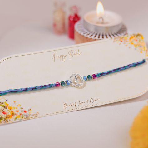 Experience the grace and spiritual charm of our Diamond Krishna Feather Rakhi. Adorned with a shimmering diamond, each Rakhi reflects timeless elegance. The delicate Krishna feather adds a touch of divine spirituality, making it more than just a symbol of protection—it’s a piece of art. #rakshabandhan #giftingideas #giftforsister #jumka #gifthamper #bondforever #bhaibhai #earring #buddiesforlife #rakshabandhanspecial #rakshabandhangift #happyrakshabandhan #rakshabandhangifts #rakhi #giftsfo... Krishna Feather, Divine Spirituality, Raksha Bandhan Gifts, Symbol Of Protection, Happy Rakshabandhan, Gifts Fo, Raksha Bandhan, The Grace, Gift Hampers