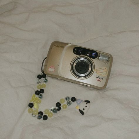 samsung ibex 70g 35mm point and shoot film camera , phone / camera charm strap , cute aesthetic pochacco charm strap , sanrio character , secondhand film camera , cute stickers Aesthetic Pochacco, Camera Charm, Point And Shoot Film Camera, Shoot Film, Phone Camera, Camera Phone, Cute Aesthetic, Sanrio Characters, Film Camera