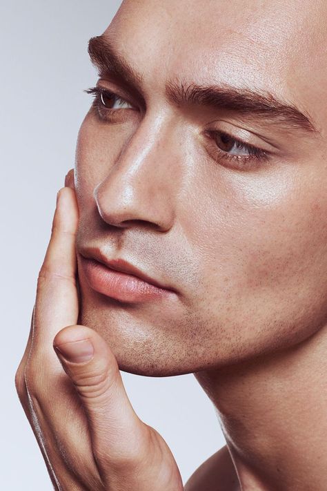 Young male model with hand on face after applying moisturiser Men Photoshoot, Beauty Clinic, Face Wrinkles, Skin Secrets, Skin Clinic, Beauty Shoot, Beauty Shots, Cosmetic Skin Care, Normal Skin