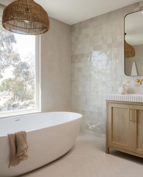 {FEATURE} I love this bathroom design! Such beautiful tiles and detailing on the vanity! I love the at tub too! Design: @markdesignco & @ashleynicokelly 📷: @charlotteleaphotography . . . Follow along @audreycrispinteriors for more interior design inspo! . . . . . . . . . . . . . . . #doingneutralright #modernfarmhouse #apartmenttherapy #theeverygirlathome #showemyourstyled #inmydomaine #cljsquad #smmakelifebeautiful #hometohave #simplystyleyourspace #currentdesignsituation #pocketofmyhome... Tile Around Tub, Modern Farmhouse Bathrooms, Best Bathroom Paint Colors, Beautiful Tiles, Beach House Bathroom, Bathroom Paint, Bathroom Paint Colors, Bathroom Design Inspiration, Living Room Design Decor