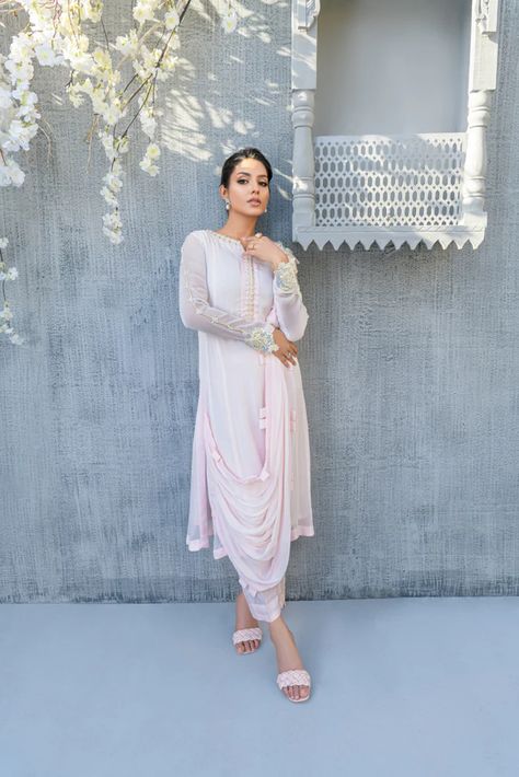 The Party Wear Shalwar Kameez is the best choice for women who prefer to dress simply and comfortably. Throughout the entire year, net and chiffon suits are ideal to wear. Have the shirts embroidered in a fashionable silhouette for a more refined appearance. Shalwars come in a variety of designs, including straight pants, dhoti shalwars, and tulip shalwars. Dresses For Eid, Pakistani Designer Dress, Sequence Fabric, Detail Embroidery, Pakistani Dresses Online, Dresses Luxury, Embroidered Shirts, Pink Aura, Eid Dresses