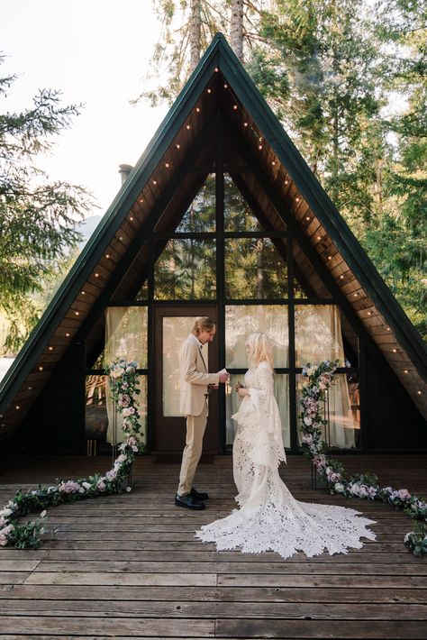 bride and groom exchange vows in front of A frame cabin Washington Cabin, Mountain Wedding Dress, Cabin Elopement, Washington Beaches, Photography Terms, Airbnb Wedding, Mt Rainier National Park, Oregon Waterfalls, Washington Elopement