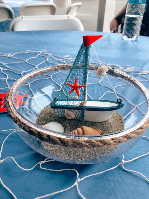 Ahoy it’s a boy - nautical themed centerpiece. Sailboat Centerpiece Ideas, Boat Centerpiece Ideas, Ahoy Its A Boy Baby Shower Ideas, Nautical Centerpiece Ideas, Sailor Baby Shower Theme, Boat Centerpieces, Shipwrecked Vbs, Nautical Baby Shower Boy, Nautical Centerpiece