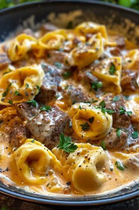 Indulge in creamy Cheesesteak Tortellini with a rich provolone sauce! Quick, cheesy, and savory dinner your family will love. #Cheesesteak #Pasta #ComfortFood #Provolone #EasyDinners Slow Cooker Cheesesteak Tortellini, Beef Tortellini Alfredo, Venison Tortellini, Cheesesteak Tortellini Provolone Sauce, Slow Cooker Cheesesteak, Cheesesteak Tortellini, Cheesesteak Pasta, Tortellini Alfredo, 30 Minute Dinners