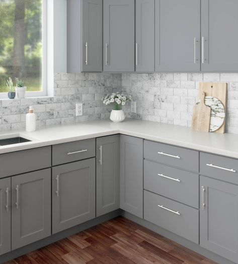 RELIABILT ready to assemble shaker style cabinets are a simple yet stylish addition to any space. The Overlake collection has a smooth painted exterior in matte gray and features all plywood, full overlay, framed construction. Its clear coat is scratch and moisture resistant, reducing damage and extending the life of your RTA kitchen cabinetry. RELIABILT Overlake 15-in W x 30-in H x 12-in D Gray Wall Ready To Assemble Plywood Cabinet (Recessed Panel Shaker Door Style) | LS-SG-W1530R Kitchen Interior Grey Cabinets, Gray Kitchen Cabinets Small Kitchen, Grey Cabinet With Black Hardware, Kitchen Remodel Light Gray Cabinets, White Kitchen With Gray Cabinets, Kitchen Decor With Grey Cabinets, Gray Kitchen Cabinets With Backsplash, Gray Kitchen Ideas Decor, Soft Gray Kitchen Cabinets