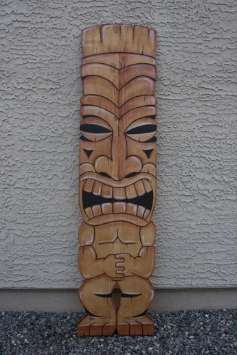 "These custom tiki wall hangings are made from 3/4\" pine. They are cut, sanded and stained. A minimum of 3 coats of exterior wood sealer is applied to both sides for added protection. Size is 11\" x 46\" Two saw tooth hangers are attached for easy hanging. Because wood is a natural product, the knots and wood grain of each board will vary Each item is handmade when ordered. If you want to change colors of stain or paint, then let me know when you order. Please allow 2 - 3 weeks for the producti Tiki Bars Diy, Tiki Signs, Tiki Man, Patio Art, Bar Stuff, Bar Wood, Hawaiian Party Decorations, Tiki Decor, Tiki Bar Decor