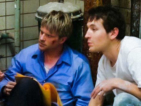 Carey Elwes and Leigh Whannell on the set of saw (2004) Lawrence Saw, Saw 2004, Leigh Whannell, Saw Film, Saw 1, Cary Elwes, Live Or Die, The Saw, Movie Genres