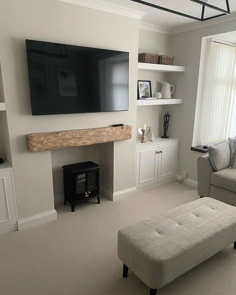 A neutral toned space with a warm greige colour on the walls, a wooden mantle over a log burner and Cormar’s Pimlico carpet in the colour Calico. Loop Pile Carpet, Alcove Cabinets, Interior Design Lounge, Log Burner Living Room, Loop Carpet, New House Living Room, Neutral Carpet, Carpet Samples, Timeless Decor