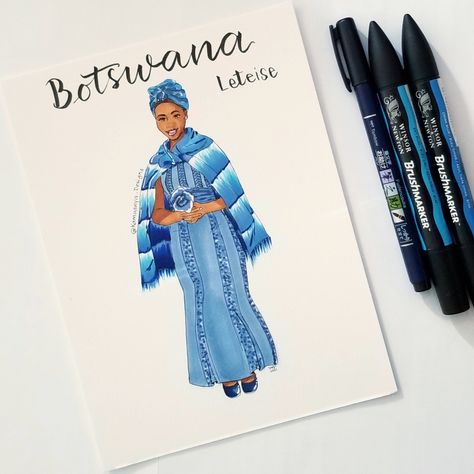 The traditional outfit of Botswana: Leteise. Blue and white traditional attire character illustration, with brush-lettering above the character. Illustration with alcohol markers by Winsor & Newton. #kdtraveltober2021 #Botswana #leteise #traditionalgarb #africanattire #Africa #Africanclothes #traditionalclothing #traditionalattire #handlettering #brushlettering #travel #postcards #travelpostcards #traveldestination #discoverAfrica ##winsorandnewton #alcoholmarkers #winsorandnewtonbrushmarkers Botswana Traditional Attire, Traditional Outfit, Winsor Newton, Brush Markers, Illustration Ideas, Winsor & Newton, Traditional Attire, Alcohol Markers, Brush Lettering