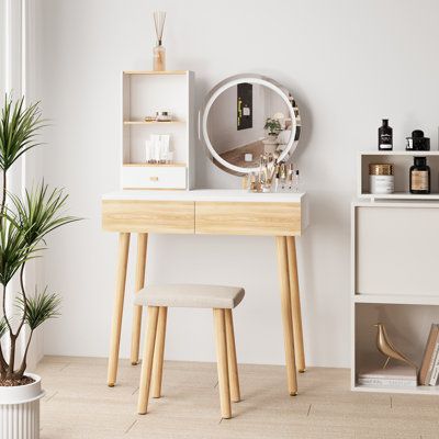 Bring sleek modern style to your bedroom or dressing room with this vanity set. This set includes a vanity table, a stool, and a mirror. The table and stool are made of solid and manufactured wood in natural and white finishes, offering a distinctive contrast. The rectangular table has splayed legs in a natural finish. It features an attached 2-shelf unit with a single drawer and two lower drawers, which offer plenty of room for makeup and accessories. The padded stool is upholstered in beige fa Mini Vanity, Vanity Makeup Table, Padded Stool, Wet Hands, Bedroom Makeup Vanity, Mirror Stool, Vanity Table Set, Bedroom Dressing, Bedroom Dressing Table