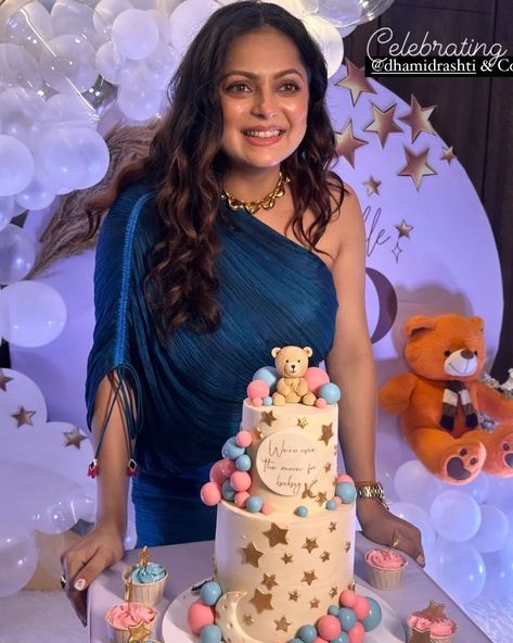 Mom-to-be, Drashti Dhami melted our hearts with the glimpses of her lunar-themed baby shower bash. The actress' maternity fashion was top-notch from her dress to her nail art. #drasthidhami #drashtidhami #drashtidhamiqueen #mommytobe #pregnancyglow #pregnant #pregnancy #babyshower #tvactress #televisionactress Baby Shower Dress For Mom, Drashti Dhami, Maternity Dresses For Baby Shower, Maternity Fashion, Baby Shower Themes, Shower, Baby Shower, Nail Art, Actresses