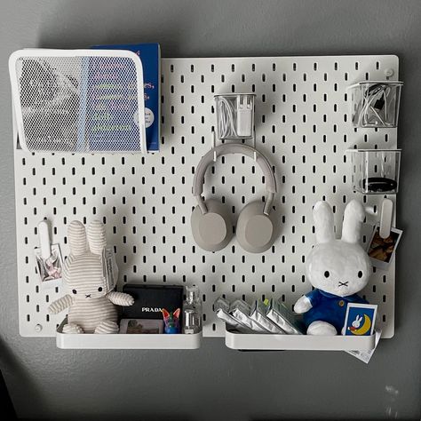 ikea skadis pegboard inspo, pegboard with headphones, books, film, keychains, electronic accessories, and miffy. polaroids add the cutest touch. room inspo, decor inspo, minimalist but also maximalist Keychain Room Decor, Ikea Skadis Pegboard Ideas, Pegboard Styling, Skadis Ikea Ideas, Ikea Pegboard Ideas, Room Inspo Decor, Skådis Ikea, Ikea Wall Storage, Skadis Pegboard