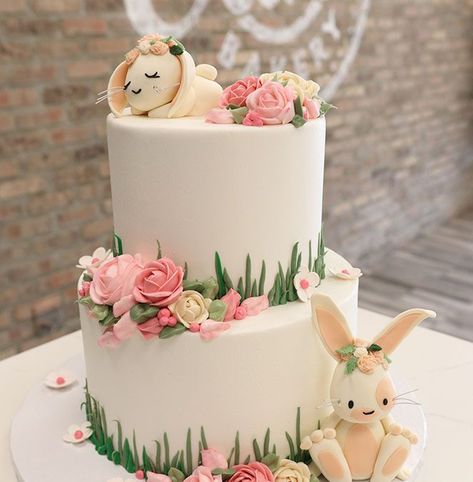 Buttercream Iced Baby Shower Cake With Sculpted Bunnies Twin Girl Baby Shower Ideas Theme, Baby Shower Cake Ideas Girl, Girl Baby Shower Cake Ideas, Flower Baby Shower Cake, Baby Girl Shower Cakes, Bunny Baby Shower Cake, Spring Baby Shower Cake, Baby Shower Girl Cake, Baby Girl Shower Cake