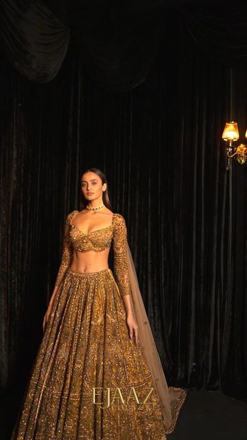 Ejaaz Couture on Instagram: "Hold your breath, or this treasured gold lehenga shall certainly take it away. Glamour is in the details of our gold finery, embellished in crystals and celebratory elements. 𝘚𝘌𝘈𝘚𝘖𝘕’𝘚 𝘋𝘐𝘈𝘔𝘖𝘕𝘋𝘚 Celebratory Couture 2022 Jewelry by @kotawalajewels — Shop with us: ⚜️at our Flagship Store : D 33, First Floor, Defence Colony, New Delhi - 110024 ⚜️Whatsapp : +91-9873789288 ⚜️Website : Link in the bio ⚜️Virtual Consultant : +91-9873789288 For inquiries & appoi Ejaaz Couture, Golden Bridal Lehenga, Golden Lehenga, Gold Lehenga, Indian Wedding Gowns, Latest Bridal Lehenga, Reception Lehenga, Indian Bride Outfits, Indian Dresses Traditional