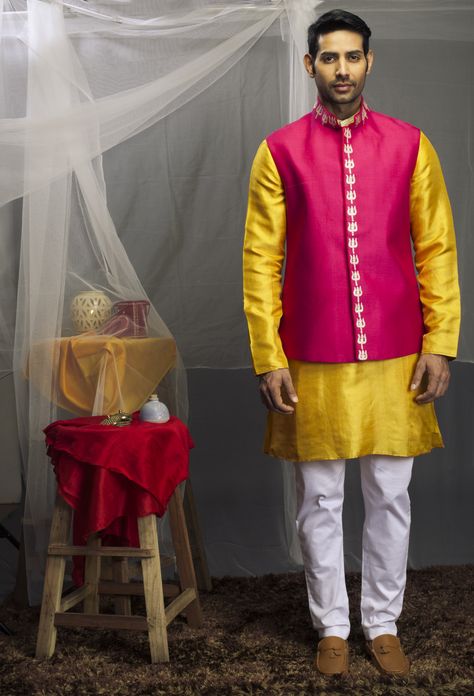 A yellow kurta and white chudidaar teamed with a pink bundi. Yellow Kurta Men, Western Men, Yellow Kurta, Kurta For Men, Rani Pink, Kurta Men, Mens Kurta Designs, Mens Kurta, Indian Couture