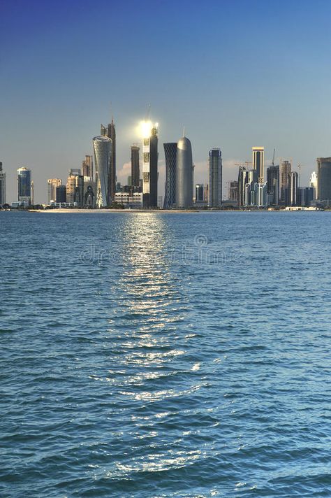 Doha, Qatar. Doha skyline with sunburst, Doha, Qatar , #SPONSORED, #Qatar, #Doha, #sunburst, #skyline #ad Doha Skyline, Qatar Doha, Doha Qatar, Doha, Resume Templates, Qatar, New York Skyline, Royalty Free Stock Photos, Solar