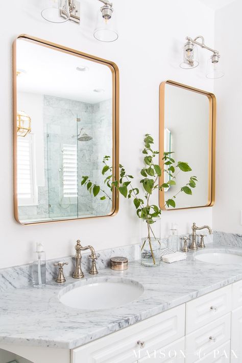 Are you hesitant to use mixed metal bathroom fixtures in your home? Mixing metals is becoming more and more popular in interior home decor, and there's no better place to experiment with this design trend than in a bathroom: Hardware, plumbing fixtures, and lighting all provide beautiful opportunities to mix metals. #bathroomdesign #hardware #modernfarmhouse Mixed Metal Bathroom Fixtures, Mixed Metals Bathroom, Polished Nickel Bathroom Faucet, Black And Gold Bathroom, Transitional Decor Bathroom, Glass Shower Doors Frameless, Silver Bathroom, Mixing Metals, Metal Bathroom