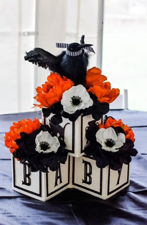 Cute Halloween Centerpieces, Spooky Baby Shower Centerpieces, Black Theme Baby Shower Ideas, Nightmare Before Christmas Centerpieces, Halloween Baby Shower Centerpieces, Baby Block Centerpieces, Nightmare Before Christmas Babyshower, Orange Mums, Halloween Table Centerpieces