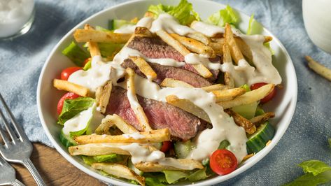 The Pittsburgh salad isn't your light side salad -- It's a salad with greens, chicken or steak, cheese, and french fries coming together in a big bowl. Pittsburgh Salad, Pittsburgh Food, Anniversary Poems, Crispy French Fries, Tossed Salad, Steak Salad, Juicy Steak, Steak And Eggs, Grilled Steak