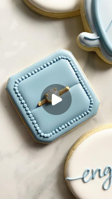 Ronnie’s Custom Cookies on Instagram: "Okay but is your diamond engagement ring edible though?! . . . . . . #cookies #cookier #cookiesofinstagram #cookiedecorating #cookiedecorator #decoratedcookies #cookievideo #cookiereels #cookiereel #cookiedecoratingvideo #cookiedecoratingvideos #engagementringcookies #ringcookies #isomaltsugar #isomalt #isomaltgems #columbusohio #columbuscookies #cookiesofcolumbus #columbusbakery #engagementcookies #weddingcookies" Easy Circle Cookie Designs, Ring Box Cookie, Ring Box Cookies Decorated, Diamond Ring Cookies, Engagement Decorated Cookies, Engagement Party Cookies Decorated, Engagement Sugar Cookies Decorated, Engagement Ring Cookies Decorated, Anniversary Decorated Cookies