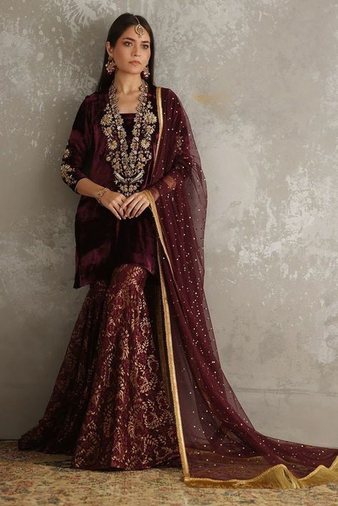 Banarasi garara, black garara suit, velvet kurti, embellished velvet top,indian wedding wear, nikah garara suit, Pakistani designer garara Short velvet kurti has beautiful zardozi and zari embroidery over the neck. It has banarasi flair garara with embellished net dupatta and zari border. If you want any changes in the outfit please contact us we will guide you as per your preference. ✨We assure you that we use only high quality fabric and threads to make any dress and you won't face any problem Banarasi Garara, Garara Suits Designs, Garara Designs, Garara Dress, Velvet Pakistani Dress, Garara Suit, Velvet Suit Design, Wedding Velvet, Plus Size Suit