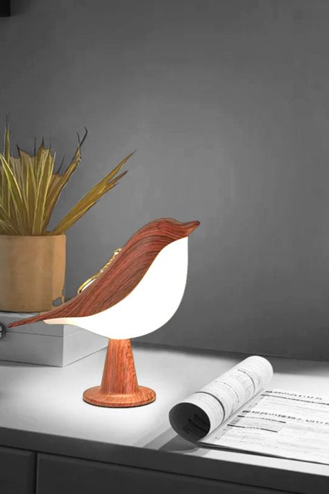 Magpie Aroma Light Lamp is a Christmas Bird fragrant lamp with touch control and usb charging line a new year gift. it is even brighter than what you are seeing in the pictures and Glows your Bedroom, living room , kids room, office and Study/work table with its beauty. Best for new years gift

product name: Christmas Bird Lamp
Product size: L21.5*W60*H15cm
Light source model: LED light source
Voltage: DC 5V(USB charging)
Dimming: Touchable
Battery capacity: 1800MA
Life: 20000 hours Table Reading Lamp, Charging Desk, Bedroom Ambiance, Bedroom Bedside Lamp, Bedroom Table, Mahogany Color, Table Led, Lampe Decoration, Wooden Bird