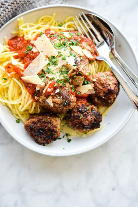 a bowl of turkey meatballs next to spaghetti noodles and red sauce Frozen Turkey Meatballs, Oven Baked Meatballs, Classic Turkey, Fed And Fit, Turkey Meatballs Baked, Turkey Meatball, Turkey Meatball Recipe, Frozen Turkey, Meatball Recipe