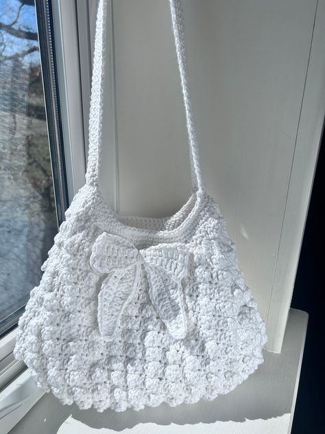 The adorable Tenley Purse is made with a thick cotton yarn to keep your valuables safe and sound. Its wide strap will take a load off your shoulders in a stylish and chic way. This handmade crochet purse styles a neutral white to accent any outfit. Snatch yours now! Purse Crochet, Handmade Purse, Kawaii Crochet, Crochet Clothing And Accessories, Girly Bags, Crochet Fashion Patterns, Crochet Purse, Quick Crochet, Fun Crochet Projects