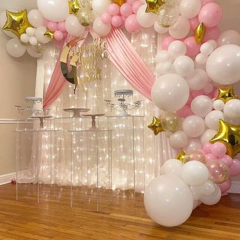 Turn your girl baby shower party ambiance into a pink wonderland by embracing everything with pink hues. For perfect party background decorations hang white organza & pink polyester curtains along with curtain lights and create an enticing balloon garland featuring white, pink, clear confetti-filled, & 4D star Mylar balloons. Highlight your party décor in a whimsical manner by placing white crystal draped cupcake holders atop acrylic pedestal risers and add festive flair all around. Curtains Backdrop, Acrylic Risers, Acrylic Pedestal, Party Ambiance, Pink Wonderland, Cupcake Holders, Light Girls, Curtain Backdrops, Cupcake Holder