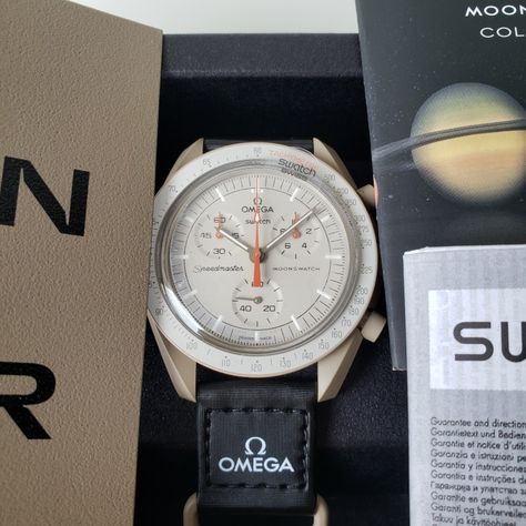 The New Omega Moonswatch.  I love the colorway on the Mossion to Jupiter. The Creamy grey with orange accents is perfect. The chronograph feels snappy too! Moon Swatch, Moonswatch Mission To Jupiter, Moonswatch Mission To Mercury, Omega X Swatch Moon, Moonswatch Mission To Mars, Swatch Omega Saturn, Orange Accents, The Mission, Athleisure Outfits