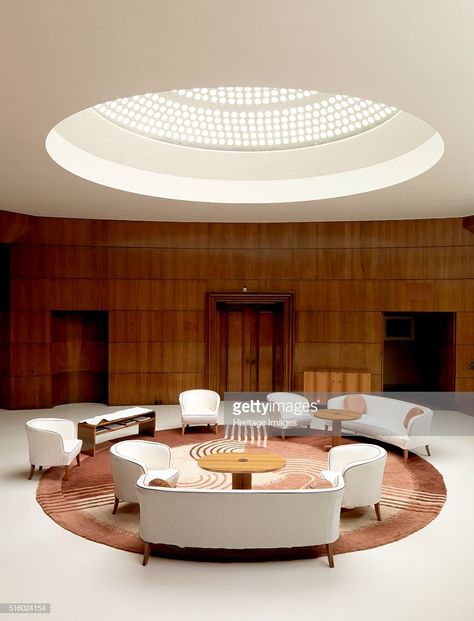 Entrance hall of Eltham Palace, Greenwich, London, 2008. Light filters down from the glass domed roof illuminating the entrance hall. Eltham was a royal palace, but by the early 20th century it was partly ruined. In the 1930s the Courtauld family used the architects Seely & Paget to restore and extend the historic buildings to create a family home. The entrance hall was designed by Swedish designer Rolf Engstromer. Artist: Historic England Staff Photographer. Eltham Palace, مركز ثقافي, Palace London, Lobby Lounge, Plafond Design, Art Deco Home, Art Deco Architecture, Interior Modern, Main Entrance